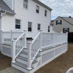 White two-story house with a newly built deck, showcasing XTEND Contracting’s expertise in deck construction and exterior remodeling.